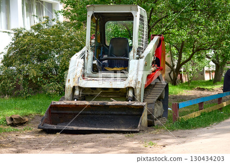 Bulldozer tractor with rubber tracks during excavation work Bulldozer tractor with rubber tracks during excavation work 130434203