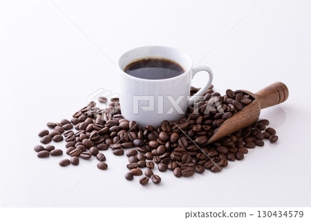 Hot coffee and coffee beans on the table 130434579