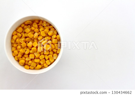 Corn kernels on a white background viewed from directly above 130434662