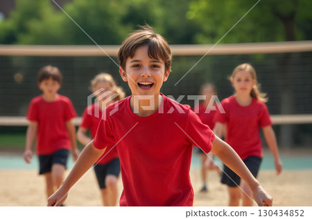 portrait of smiling boy in red t-shirt on volleyball court portrait of smiling boy in red t-shirt on volleyball court 130434852
