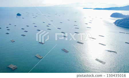 Okayama Prefecture, Seto Inland Sea, Oyster rafts and beautiful islands, fishing scene, drone aerial photography, seascape 130435016