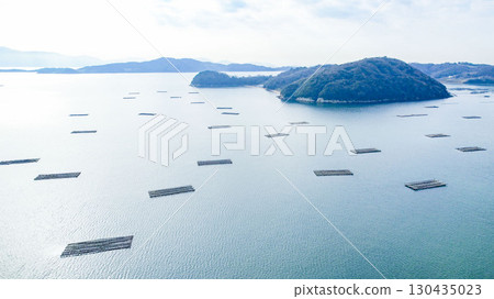 Okayama Prefecture, Seto Inland Sea, Oyster rafts and beautiful islands, fishing scene, drone aerial photography, seascape 130435023