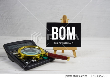 BOM Bill Of Materials text with magnifying glass and calculator on wooden background BOM Bill Of Materials text with magnifying glass and calculator on wooden background 130435200