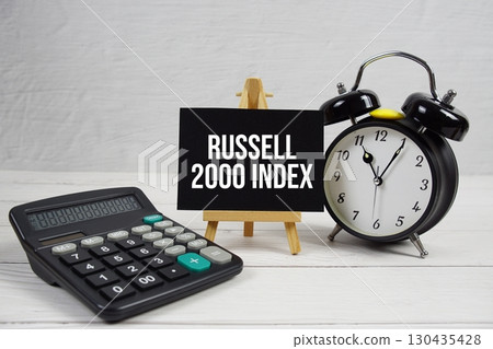 Russell 2000 Index text with alarm clock and calculator on wooden background Russell 2000 Index text with alarm clock and calculator on wooden background 130435428