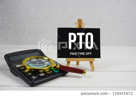 PTO abbreviation of Paid Time Off text with magnifying glass and calculator on wooden background 130435672