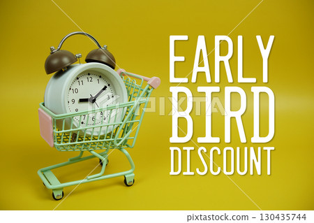 Early Bird Discount text with trolley shopping cart and alarm clock on yellow background Early Bird Discount text with trolley shopping cart and alarm clock on yellow background 130435744