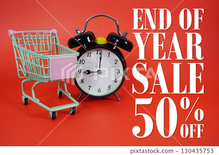 Year End Sale 50% off Promotion and Marketing with trolley shopping cart and alarm clock on red background 130435753