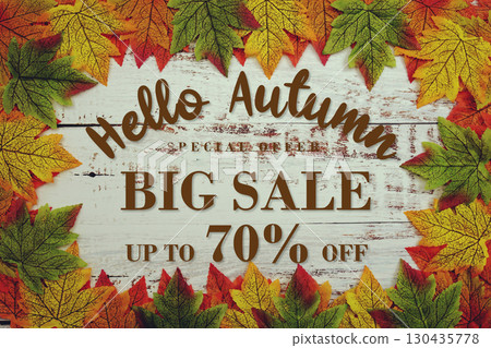 Hello Autumn Big Sale 70% with maple leaf decortaed on wooden background Hello Autumn Big Sale 70% with maple leaf decortaed on wooden background 130435778