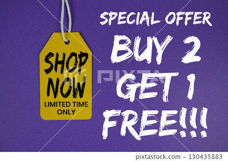 Buy 2 Get 1 Free!!! special offer with price tag on purple background 130435883