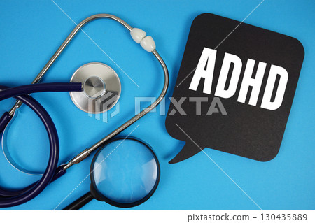ADHD Attention Deficit Hyperactivity Disorder text with Stethoscope and magnifying glass on blue background ADHD Attention Deficit Hyperactivity Disorder text with Stethoscope and magnifying glass on blue background 130435889