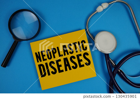 Neoplastic Diseases text with Stethoscope and magnifying glass on blue background Neoplastic Diseases text with Stethoscope and magnifying glass on blue background 130435901
