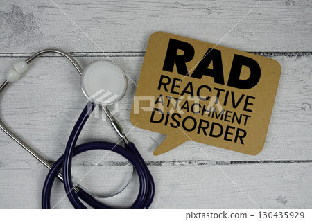 RAD Reactive Attachment Disorder text with Stethoscope on wooden background RAD Reactive Attachment Disorder text with Stethoscope on wooden background 130435929