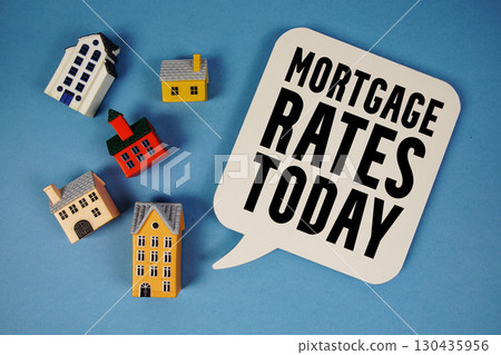 Mortgage Rates Today text with house models on blue background Mortgage Rates Today text with house models on blue background 130435956