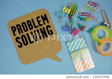 Problem Solving text with stationery on blue background Problem Solving text with stationery on blue background 130435998