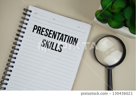 Presentation Skills text on paper notebook with magnifying glass on beige leather background Presentation Skills text on paper notebook with magnifying glass on beige leather background 130436021