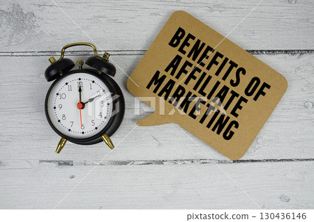 Benefits of Affiliate Marketing text with alarm clock on wooden background 130436146