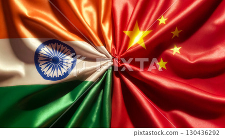 flags of china and india tied in a knot and lying next to each other, cooperation concept 130436292