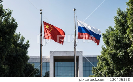 waving flags of china and russia in front of modern building, international relations concept 130436328