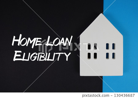 Home Loan Eligibility text with house models on black background Home Loan Eligibility text with house models on black background 130436687