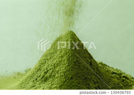 Image of matcha powder on a green background 130436793