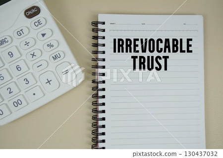Irrevocable Trust text with calculator phrase of business and financial concept 130437032