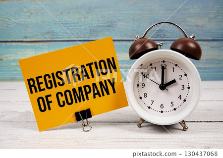 Registration Of Company (ROC) text written on paper card with alarm clock on wooden background Registration Of Company (ROC) text written on paper card with alarm clock on wooden background 130437068