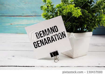 Demand Generation text written on paper card on wooden background 130437080