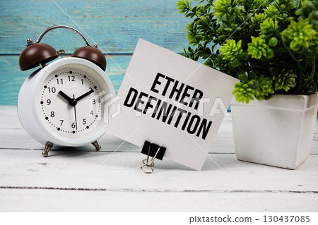Ether Definition text written on paper card with alarm clock on wooden background Ether Definition text written on paper card with alarm clock on wooden background 130437085