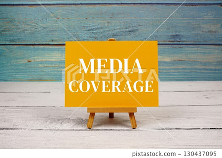 Media Coverage text written on paper card on wooden background 130437095