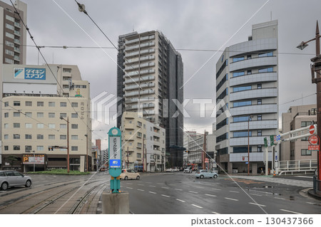 March 28 2025 Urban Intersection with Modern Buildings and Overcast Sky, Japan March 28 2025 Urban Intersection with Modern Buildings and Overcast Sky, Japan 130437366