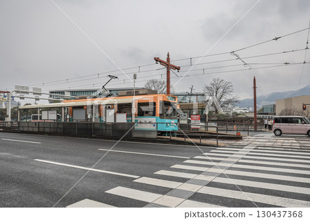 March 28 2025 Public Streetcar and Pedestrian Crossing in Urban, Japan 130437368