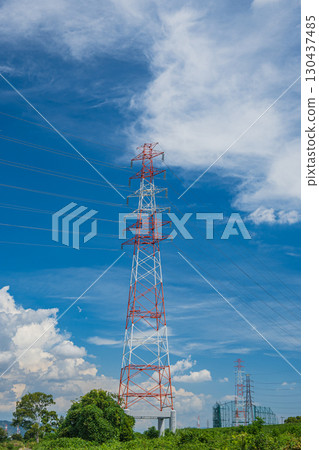 Power line tower standing on the banks of the Yodo River, Hirakata City 130437485