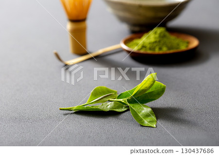 Making matcha. Image of matcha on a black background. 130437686