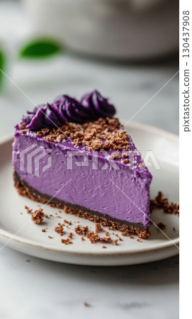 Delicious slice of purple sweet potato cheesecake with chocolate crust 130437908