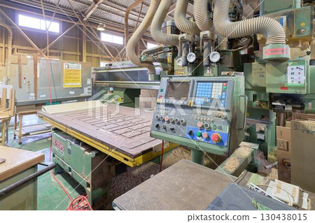 Numerical control router machine installed in a woodworking shop Numerical control router machine installed in a woodworking shop 130438015