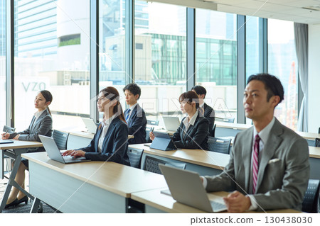 People receiving in-house training 130438030