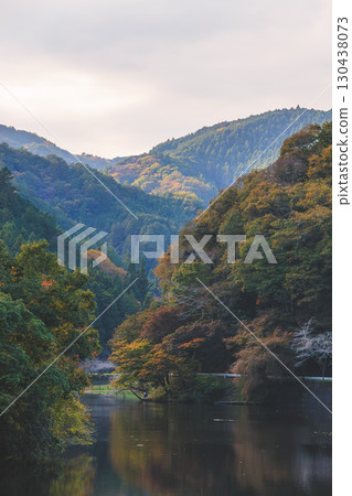 Lake Kamokita under cloudy skies during the autumn foliage season Lake Kamokita under cloudy skies during the autumn foliage season 130438073