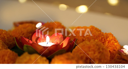 Diwali Celebration. Beautiful floral arrangement with candles and marigold flowers. Diwali Celebration. Beautiful floral arrangement with candles and marigold flowers. 130438104