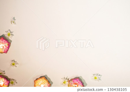 Diwali Festival. Simple Arrangement of Diyas and Flowers for Celebratory Mood Diwali Festival. Simple Arrangement of Diyas and Flowers for Celebratory Mood 130438105