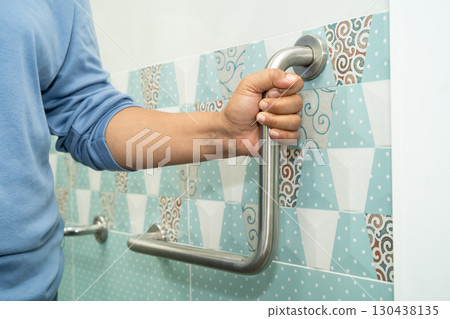 Asian elderly woman use toilet bathroom handle security, healthy strong medical. 130438135