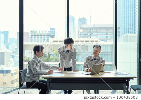 A man in work clothes having a meeting 130438508