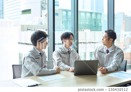 A man in work clothes having a meeting 130438512