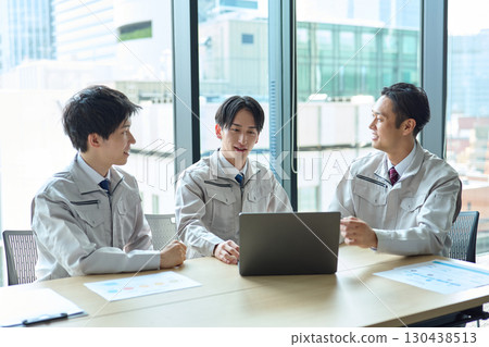 A man in work clothes having a meeting 130438513