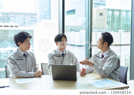 A man in work clothes having a meeting 130438514