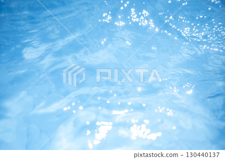 Sparkling water surface of a summer pool 130440137