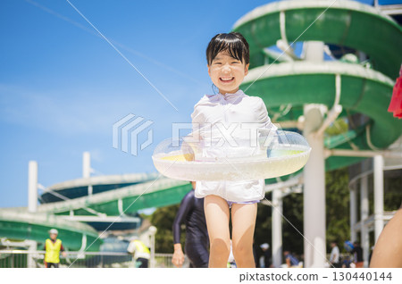 Smiling children playing in the pool during summer vacation 130440144