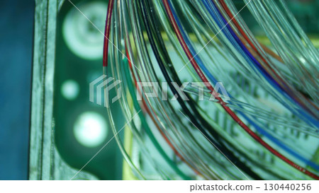 Futuristic abstract background of glowing complex fiber optic cable network. close up on colorful wire represents modern communication technology and high speed data transfer 130440256