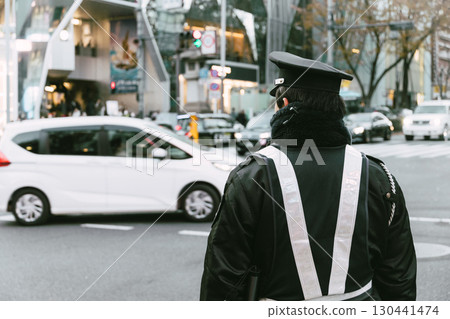 Japanese Traffic police officer working operation at busy road in the downtown street for safety Japanese Traffic police officer working operation at busy road in the downtown street for safety 130441474