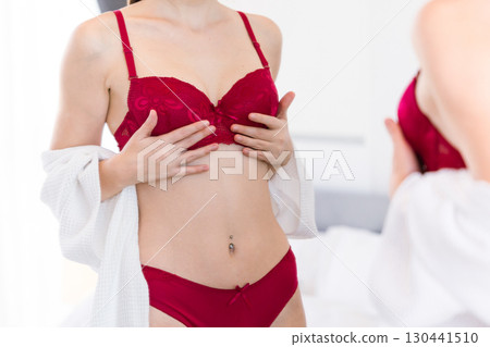 Woman trying bra hand support, lady choice underwear, worry small breast cup size, try lingerie 130441510