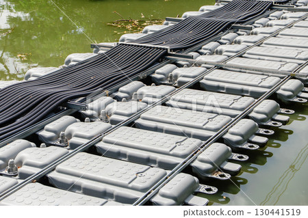 Floating Solar Panel electricity cable. Solar photovoltaic panel PV System in water pond lake 130441519